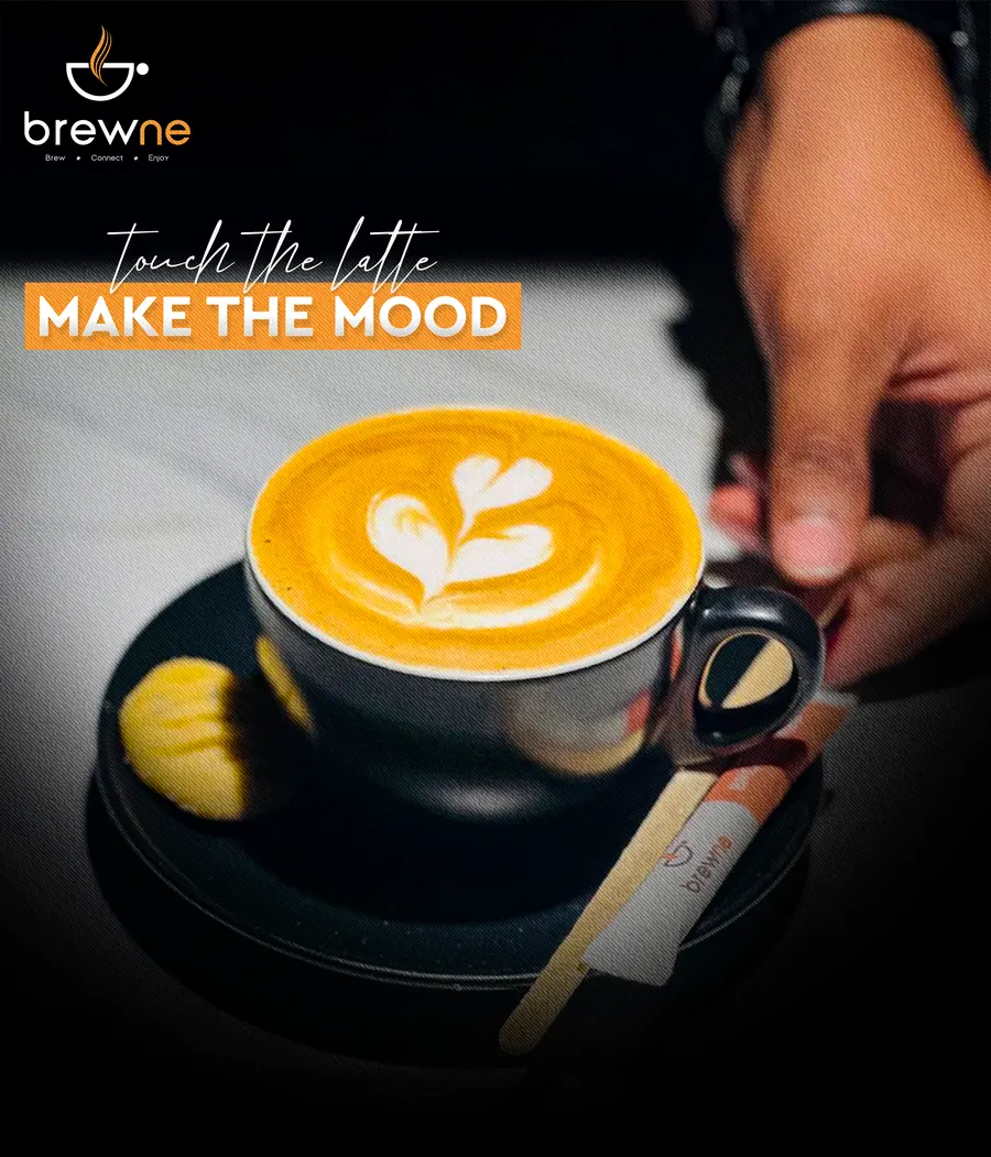 Poster: touch the latte, make the mood. A latte with heart art on a dark saucer.